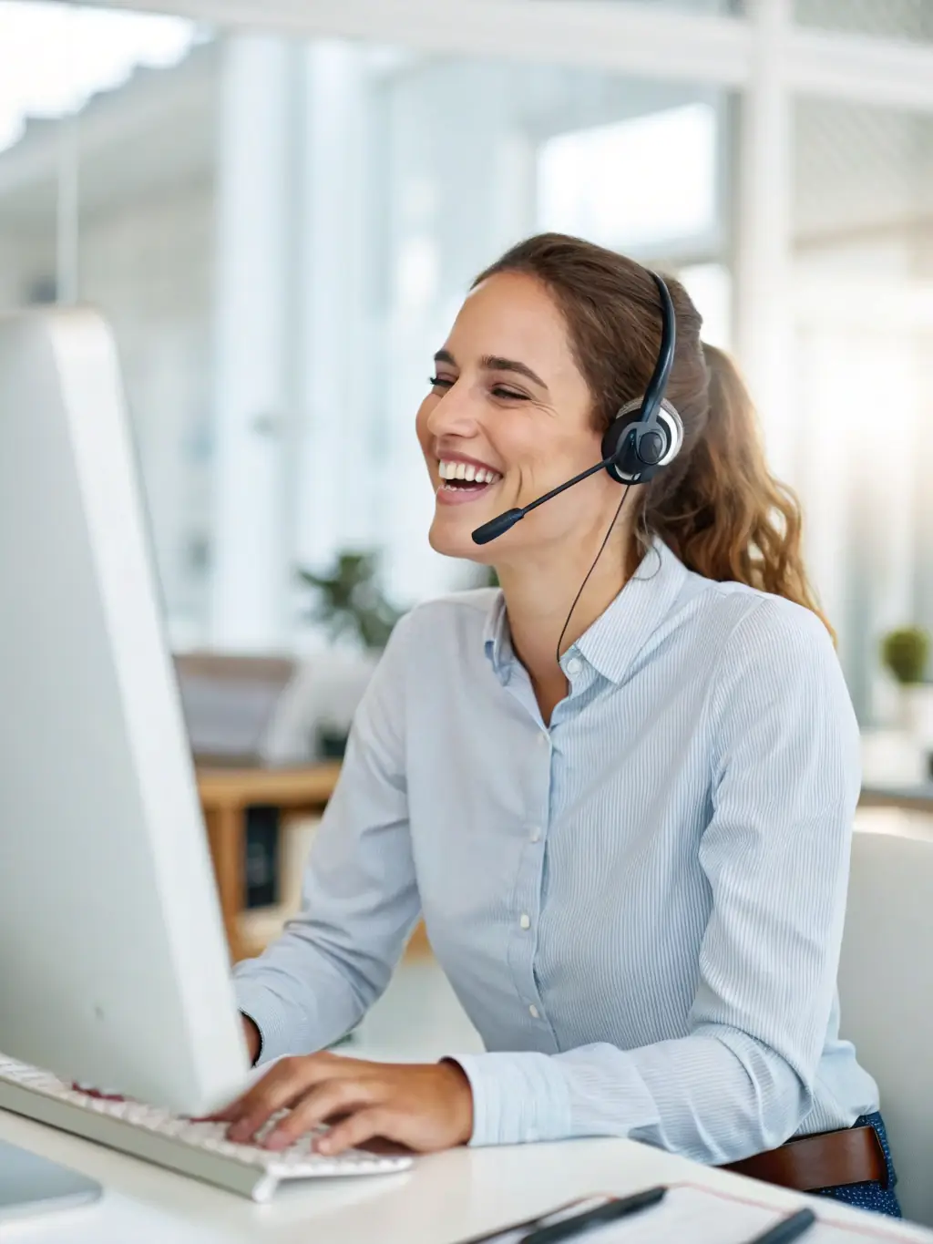 A customer service representative assisting a business client with their telecommunications setup, highlighting RDVCalls' commitment to support.
